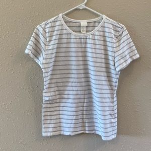 H&M white with black stripped short sleeve shirt. Size Large but fits smaller.